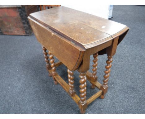 An oak barley twist gate leg table 