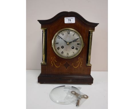 An Edwardian inlaid mahogany mantel clock with silvered dial and French movement