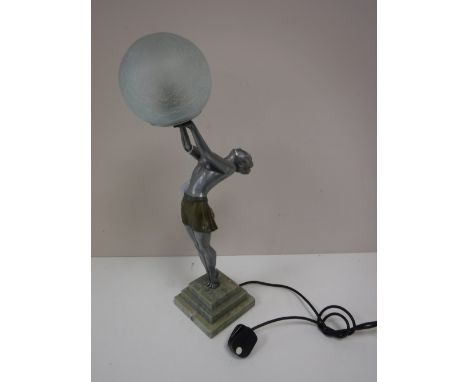 An Art Deco style figural table lamp with glass ball shade on marble base