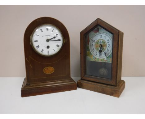 An inlaid mahogany domed topped mantel clock with enamelled dial retailed by Walker & Hall, and an American style mantel cloc