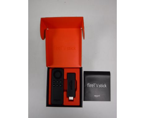 A boxed Amazon TV Fire Stick 