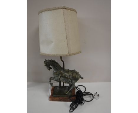 An early 20th century figural table lamp of a horse on marble base with shade 