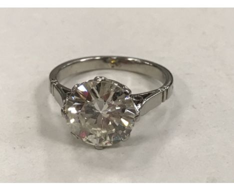 A fine quality platinum solitaire diamond ring, the brilliant cut stone weighing an estimated 2.50 carat