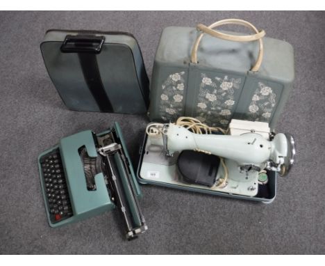 A cased Jones electric sewing machine and an Olivetti 32 typewriter 