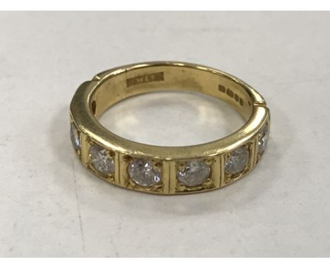 An 18ct gold seven stone half-eternity ring, approximately 1.4 carat, 5.7g