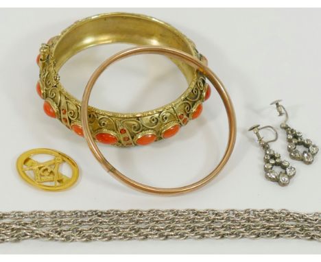 A coral and gilt bangle and a gold and silver bangle, a pair of 19th paste drop earrings and a 9 carat gold masonic clip, 1.6