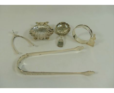 A George IV silver caddy spoon, Birmingham 1826, 8.3cm long, a pair of silver sugar tongs by Peter, Anne and William Bateman,