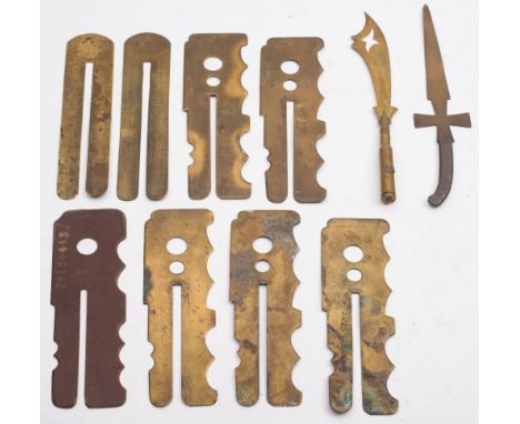 A group of various brass button sticks and two trench art letter openers:.