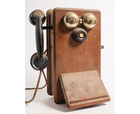 Two Ericsson N2516T mahogany cased wall mounted telephones:, with black bakelite handset, push button call, side winding hand