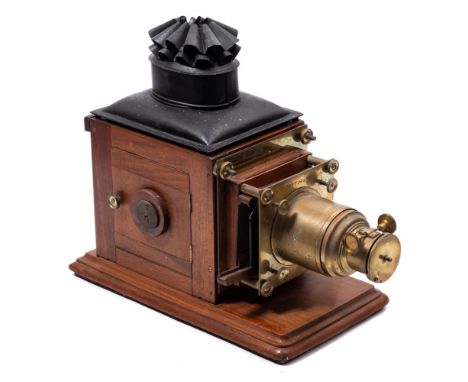 A late 19th century mahogany and brass 'Optimus' magic lantern by Perkinson &amp;  Rayment, London:, black Russian lacquer ch