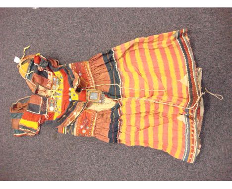 An early 20th century Indian patchwork four piece costume: comprising;- shirt, blouse , jacket and scarf, decorated with sewn