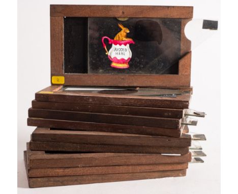 A group of ten hand painted magic lantern glass slipping slides:, including 'Jugged hare' , a grave digger startled by a ghos