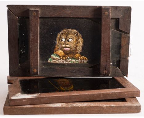 A 19th century hand painted magic lantern double slipping slide of a lion:, with moving jaw and eyes, unsigned, together with