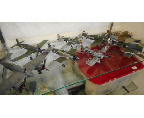 A collection of 1:48 and 1:32 scale model aircraft:, including P45 Mustangs and P47 Thunderbolts.