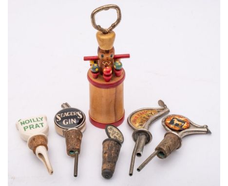 A mid-20th century novelty 'Mr Bartender' corkscrew, together with a group of advertising spirit pourers.: