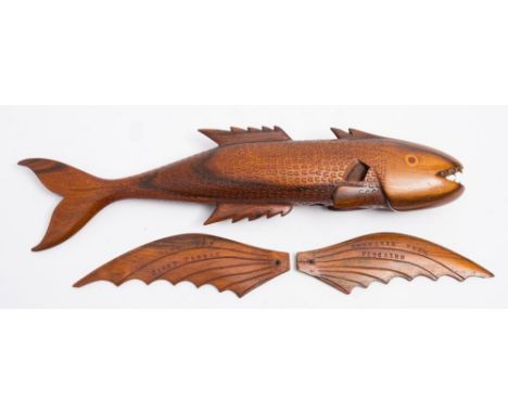 A Pitcairn carved wooden model of a flying fish by 'Jacob Warren':, open mouth with teeth and inlaid eyes, the body with scal