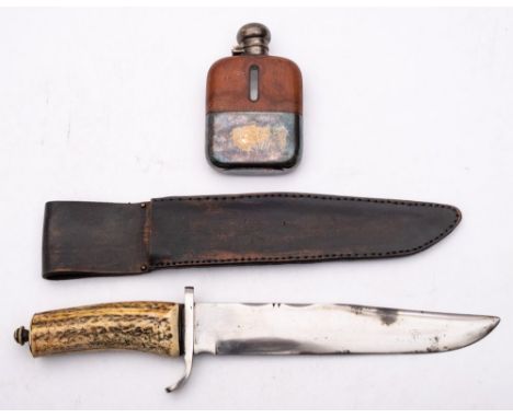 A Bowie style knife:, unsigned with simulated stag horn grip in a black leather scabbard, together with a silver plate mounte