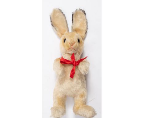 A Steiff  white plush hare:, standing with stitched nose and mouth , glass eyes, floppy ears with button to left ear, 36cm hi
