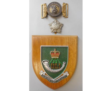 A Northumberland Fusiliers belt buckle,: a Durham Light Infantry mess badge on oak shield and Machine Gun Guards pressed meta