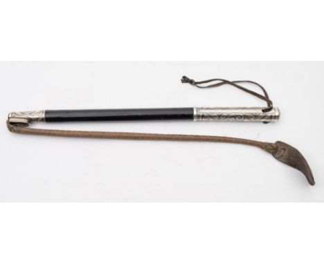 An early 20th century Russian nagaika (riding crop):, the ebonised shaft with niello work grip and whip mount, the shaft stam