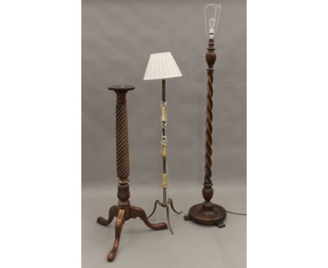 A barley twist standard lamp, another standard lamp and a torchere. The former 180 cm high overall.