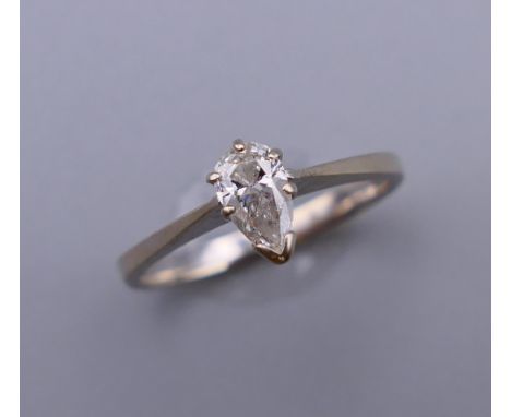 A 14 ct white gold marquise cut diamond ring. Ring size K/L.