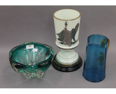 A Victorian glass oil lamp base, a blue glass jug and an art glass vase. The former 28 cm high.