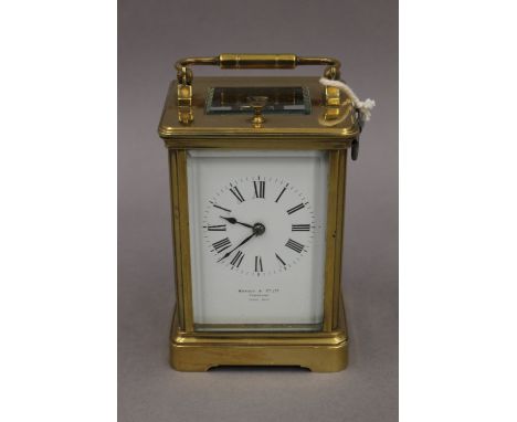 An early 20th century eight-day chiming and repeating Paris made carriage clock, the white enamel face with Roman numerals, r