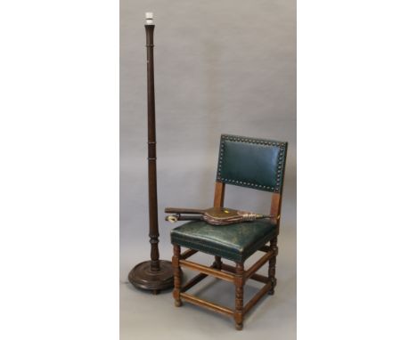 A leather covered oak chair, a standard lamp and a set of bellows