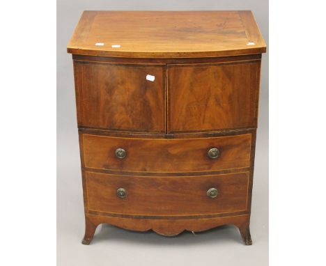 A George III mahogany commode. 60.5 cm wide.