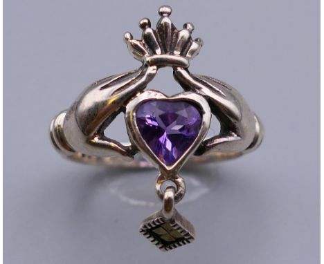 A silver Claddagh ring. Ring size M.