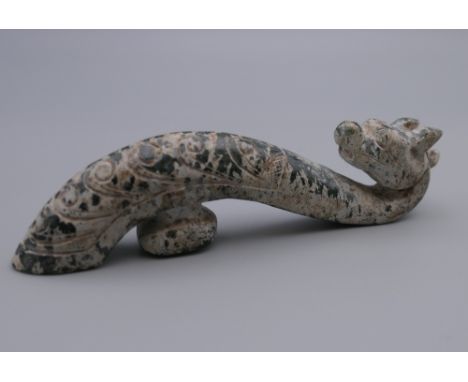 A Chinese jade belt hook. 10.5 cm high.