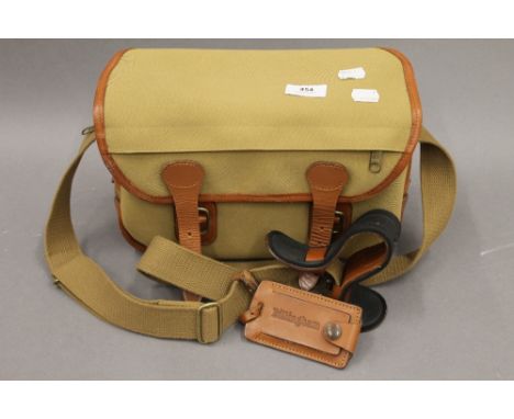 A Billingham camera and lens shoulder bag. 30 cm wide.