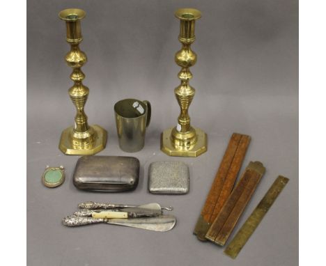 A quantity of various metalware, including silver button hook and shoe lasts, and three rules, etc.