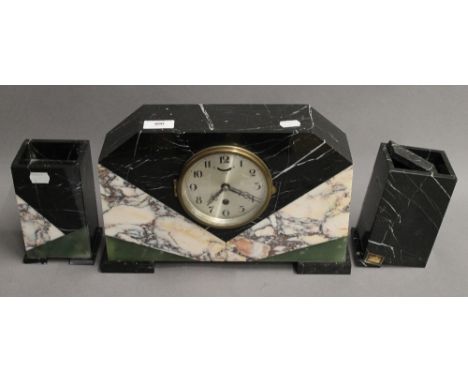 An Art Deco mantle clock garniture. The clock 22 cm high.