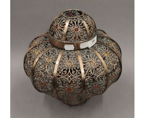 A Moroccan style light shade. 31 cm high.