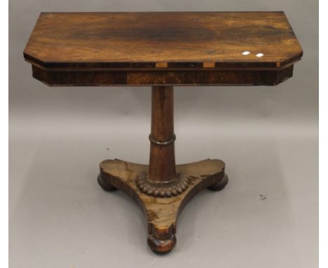 An early 19th century rosewood fold over card table. 91.5 cm wide.