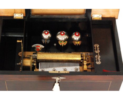 A bells-in-view musical box, playing ten airs with butterfly strikers and tune card, cylinder 15cm in line inlaid mahogany ca