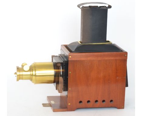 A late 19th Century mahogany and brass magic lantern by Perkens Son and Rayment with original three wick oil lamp and chimney