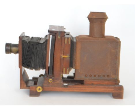 A Victorian mahogany cased magic lantern with black bellows together with various boxed slides. 