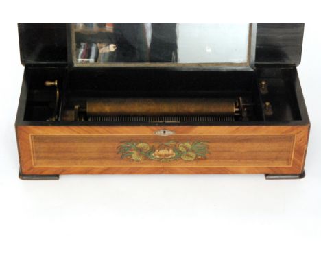 A musical box playing twelve airs with tune card, cylinder 33cm in a crossbanded inlaid walnut case decorated with a basket o