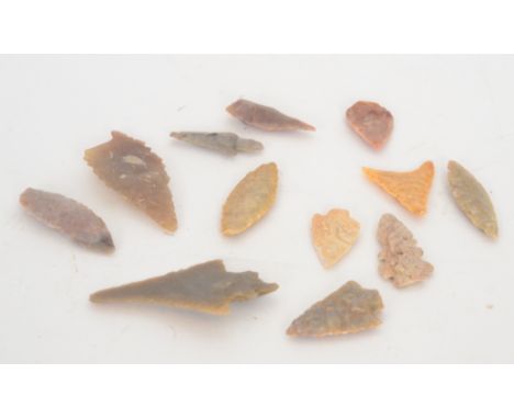 A collection of twelve Neolithic worked flint arrow heads of various sizes reputedly from the Sahara (12)