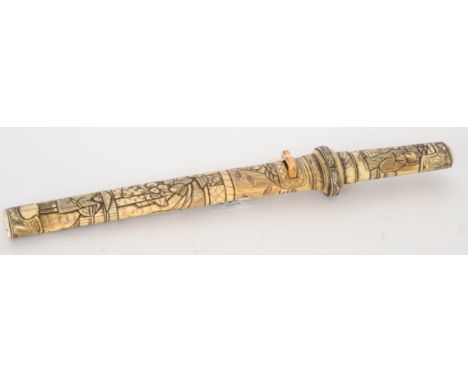 A late 19th Century Japanese carved bone short sword and scabbard decorated with figures in village scenes, length 42cm