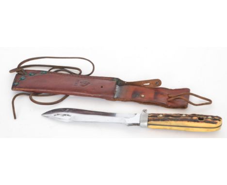 A Puma hunting knife in leather scabbard complete with original plastic case.