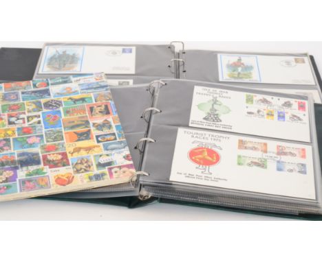 An album of first day covers mainly locomotives also TV related cards a similar album of military and a stock of world stamps
