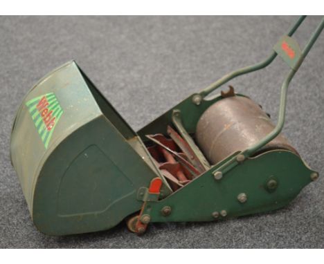 A mid 20th Century 'Whippet' push along lawn mower with grass box by H.C Webb & Co Ltd with manual card.