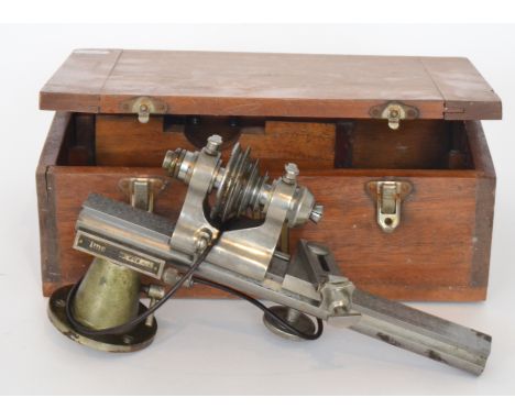 A 1930s watchmaker's lathe and tools in a fitted mahogany case.