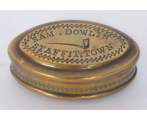 An early 20th Century oval brass snuff box the cover engraved 'Sam.Dowlin Staffit.Town', width 7cm.