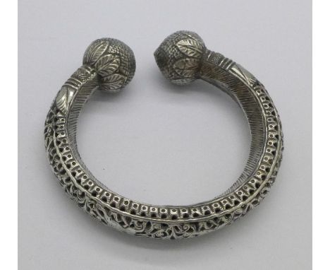 A white metal torc bangle