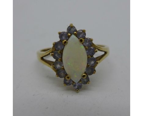 A 9ct gold, opal and tanzanite ring, 2.1g, M